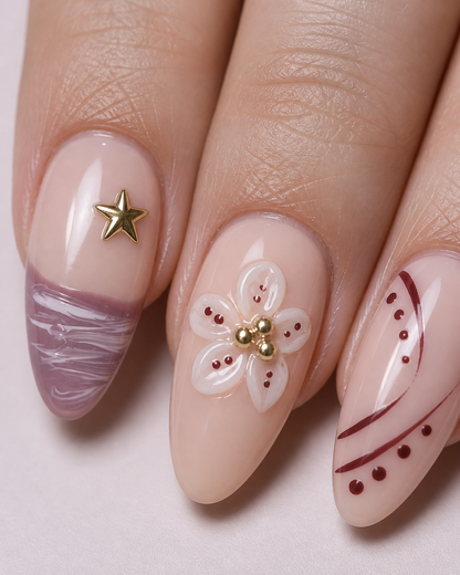 Close-up of Mauve Starlight flower, gold star, mauve ripple and curved-line nail details.